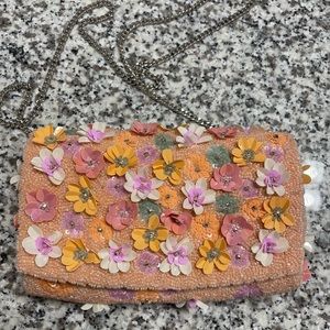 Colorful flower clutch with chain.
